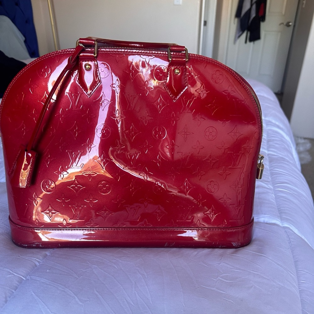 Large red Alma Louis Vuitton purse